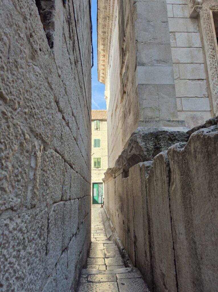 Let Me Pass Street, a unique, narrow walkway in Split’s Old City, surrounded by stone walls.