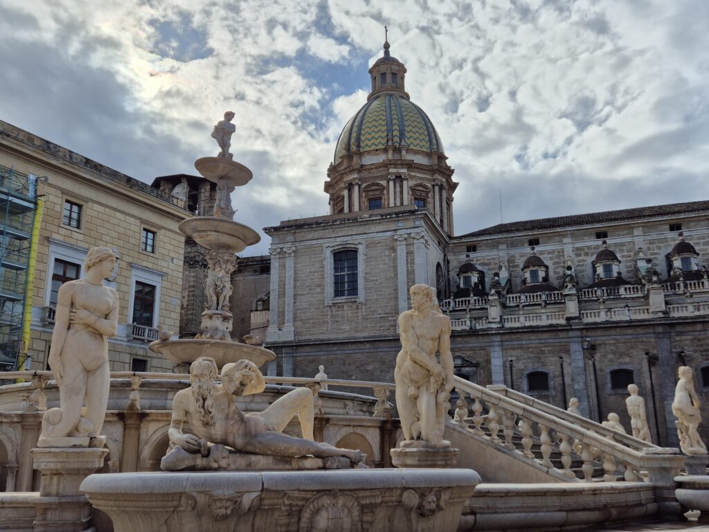 The beautiful Fontana Pretoria, also known as the "Fountain of Shame," with its intricate sculptures and cascading water, set in the heart of Palermo's historic center.